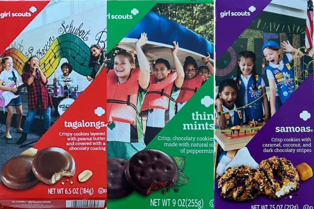 Three boxes of Girl Scout cookies: Tagalongs, Thin Mints, and Samoas. Each displays colorful images of children engaging in activities.