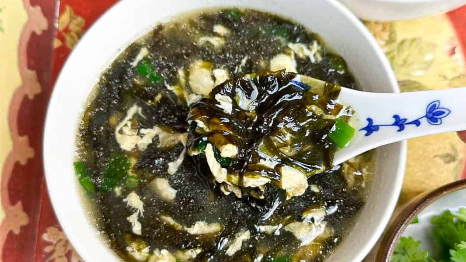 Light and soothing Chinese egg drop soup with seaweed in a bowl.