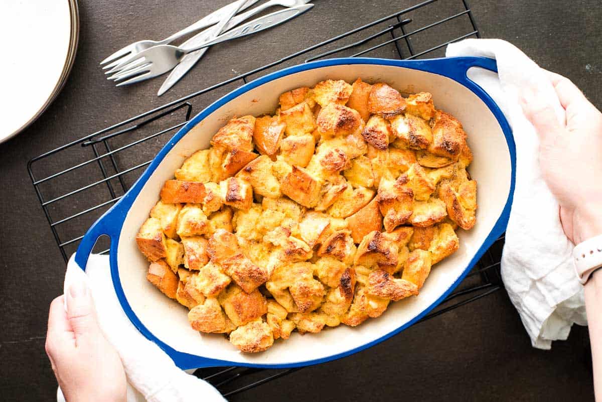 Overnight maple clementine French toast casserole in a white baking dish.