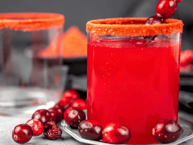 Cranberry juice with fresh cranberries.