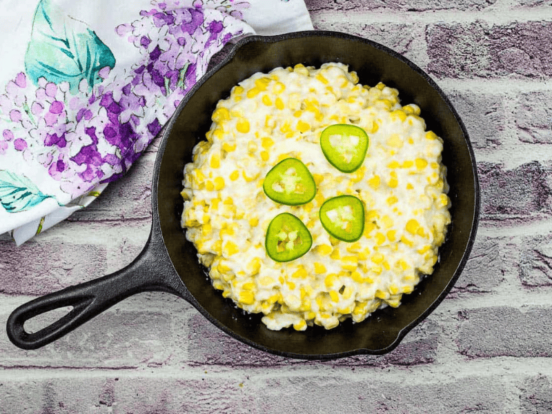 Smoked Creamed Corn in a black skillet.