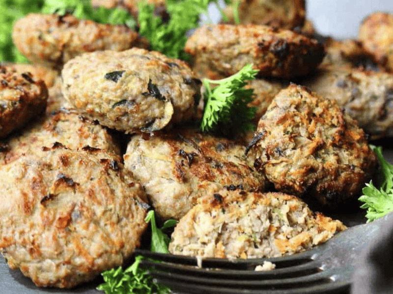Mini burgers with parsley.