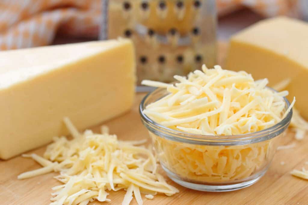 A bowl of shredded cheese.