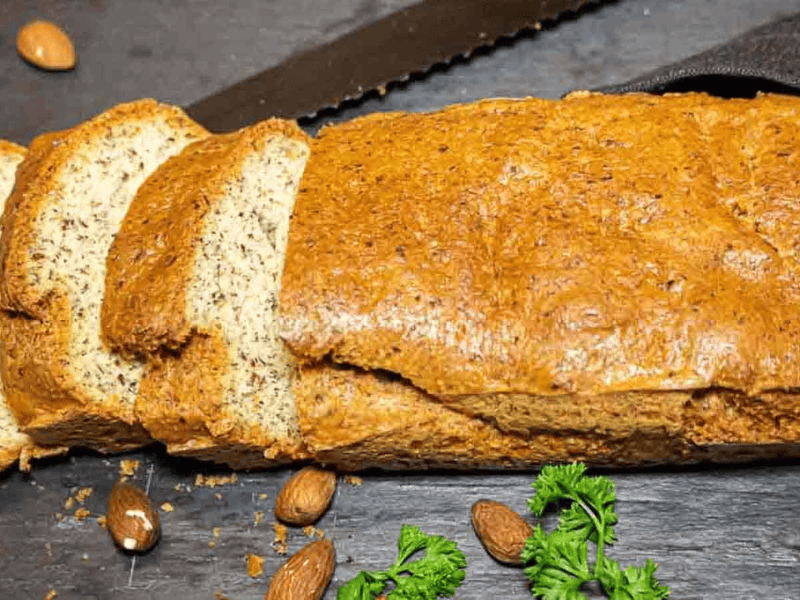 Almond flour bread on a black board sliced.