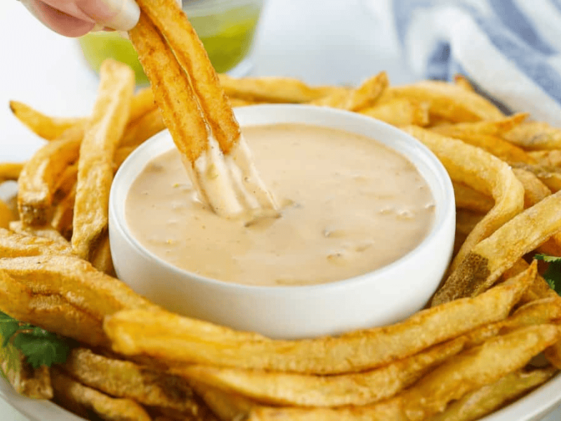 Copycat Animal Sauce in a bowl with fries around it.