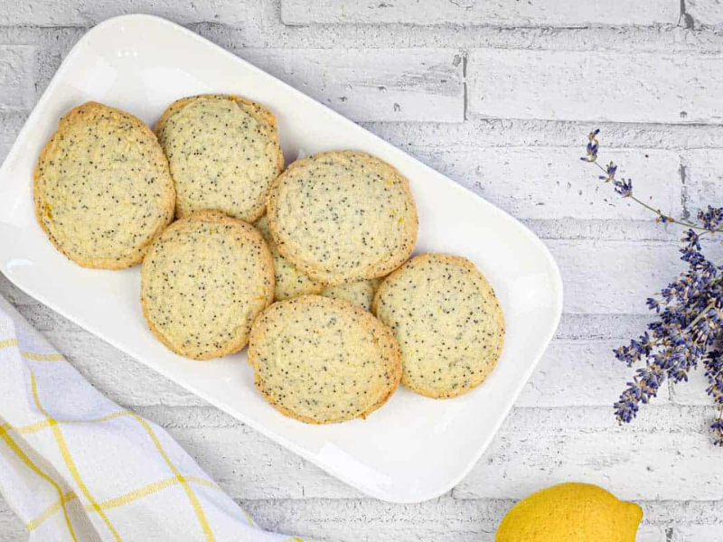 A top-down shot of Lemon Poppy Seed Cookies on a white plate.