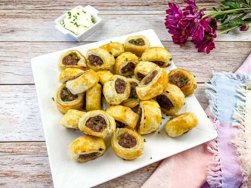 Sausage Rolls on a white plate.