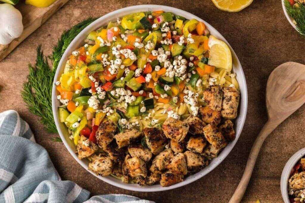A bowl of food with a fork and knife, perfect for those seeking quick workday meal ideas.