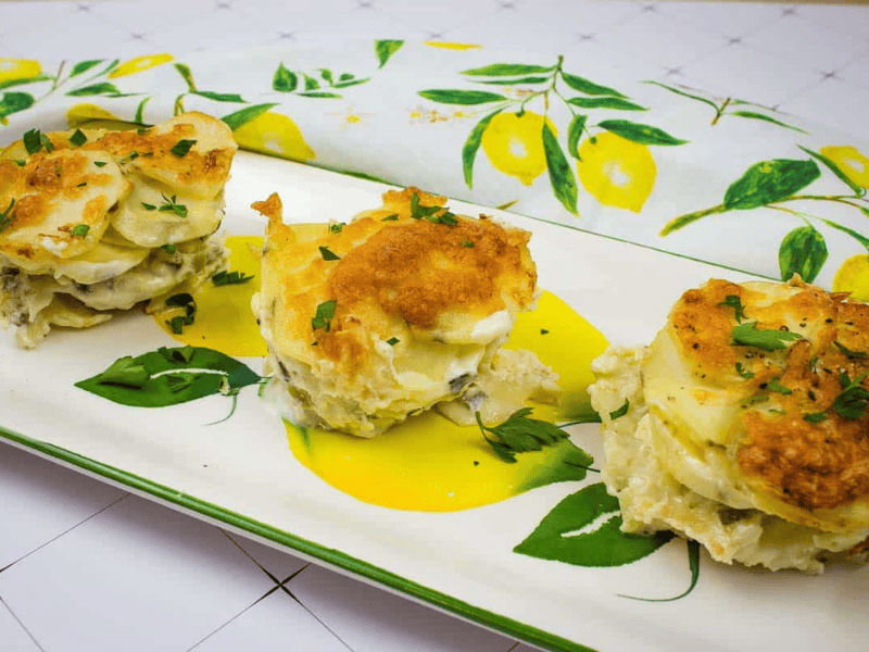 Au Gratin Potato Stacks on a white plate.