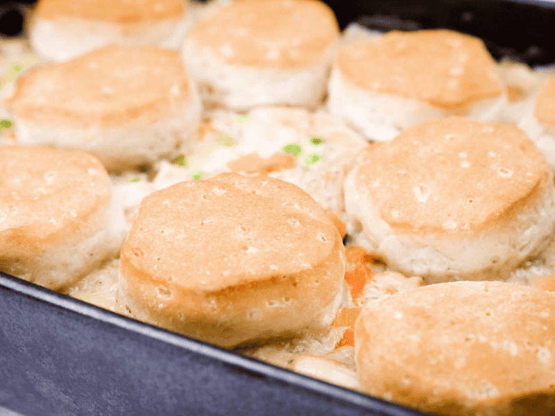 A baking dish filled with Biscuit-Topped Chicken Pot Pie.