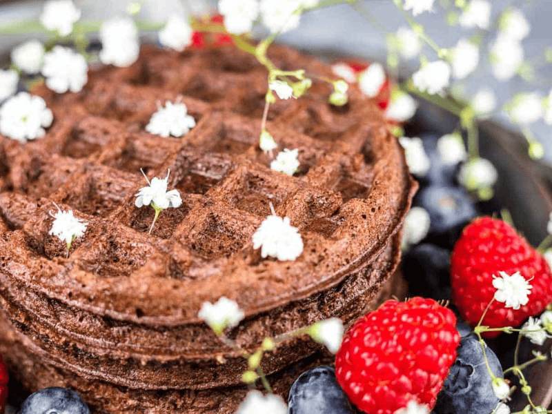 Chocolate Chaffle with white flowers.