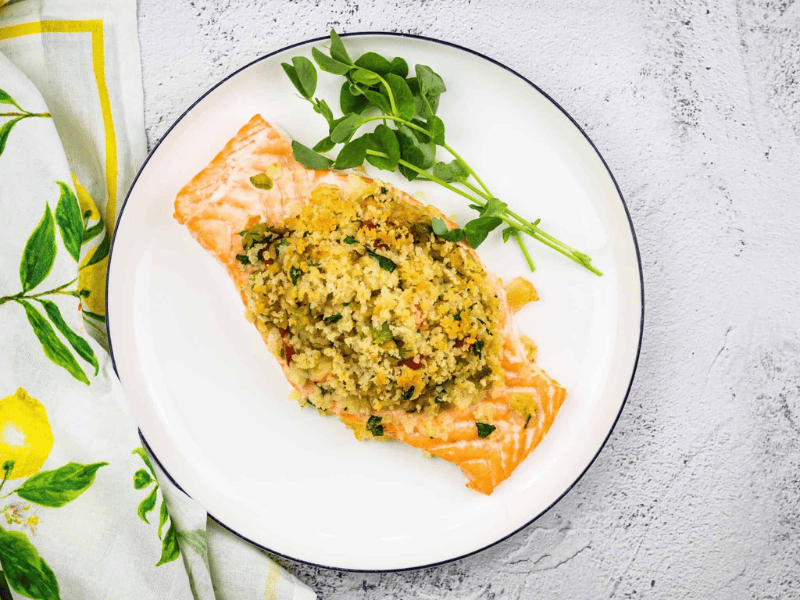 Seafood Stuffed Salmon on a circular white plate.