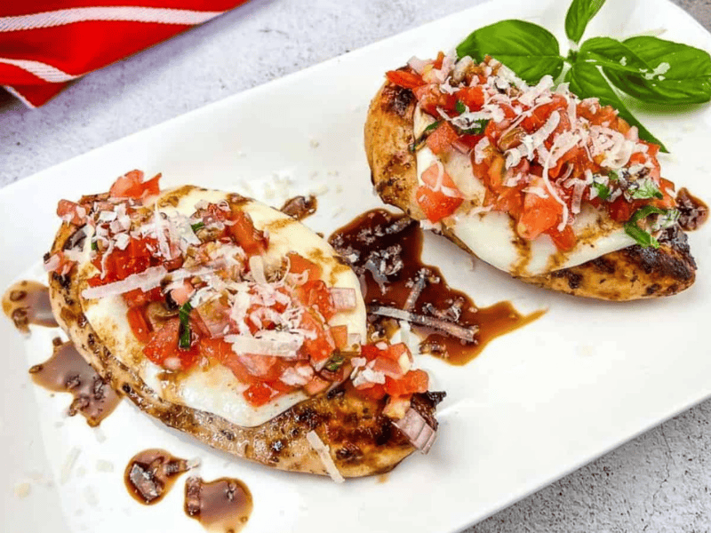 Grilled Bruschetta Chicken on a white plate.