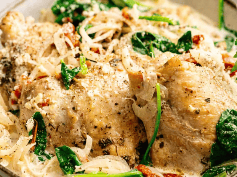 A bowl of food with vegetables.