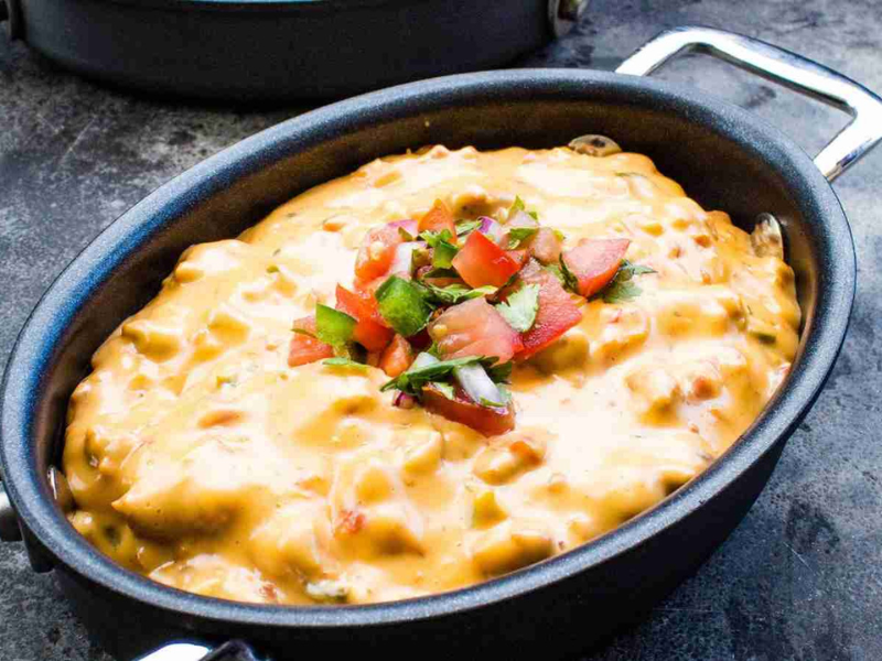 Smoked queso in a black pot.