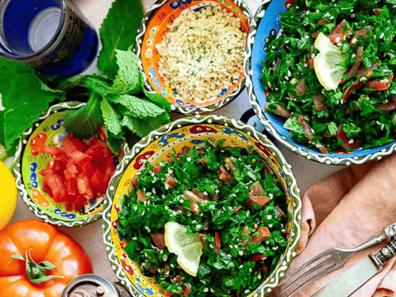 Tabbouleh Salad inside colorful bowls.