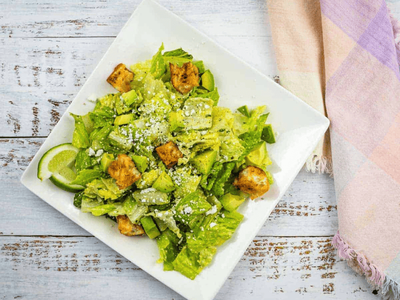 An image of Tex-Mex Caesar Salad on a square plate.