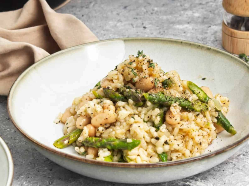 A bowl of asparagus and white bean risotto.