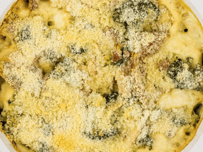 A casserole dish with broccoli and turkey.