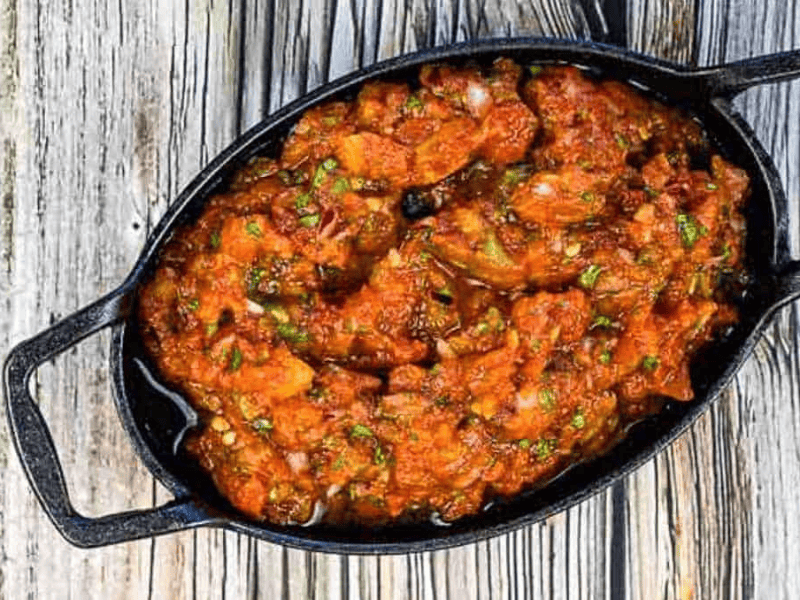 Smoked Tomato Salsa in a black dish.