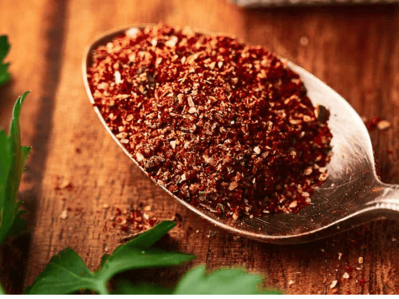 Homemade burrito seasoning on a teaspoon.