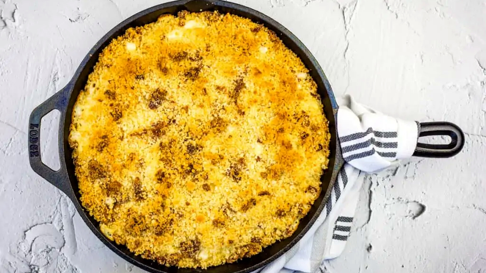 A skillet filled with Smoked Mac & Cheese.