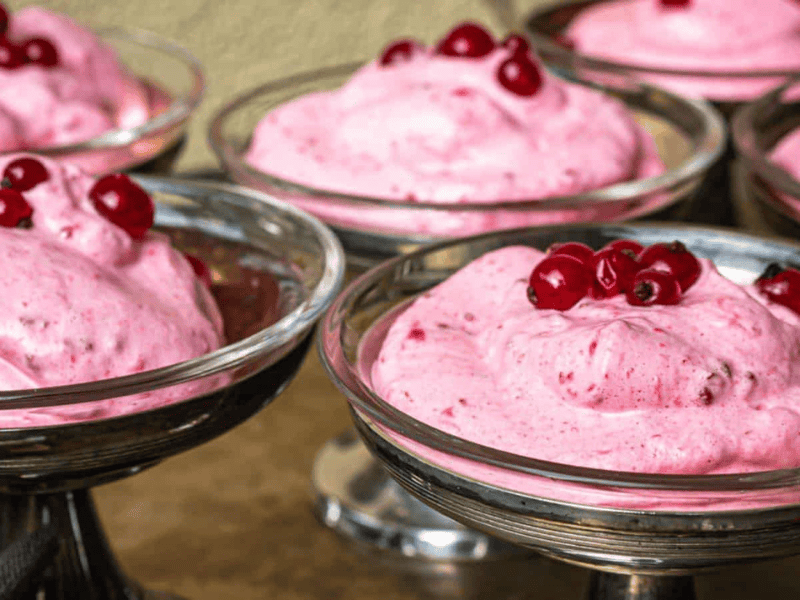 Red Currant Fluff inside glass serving bowls.