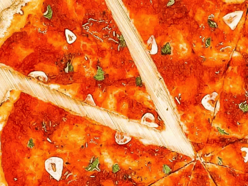 A cooked and sliced marinara pizza.