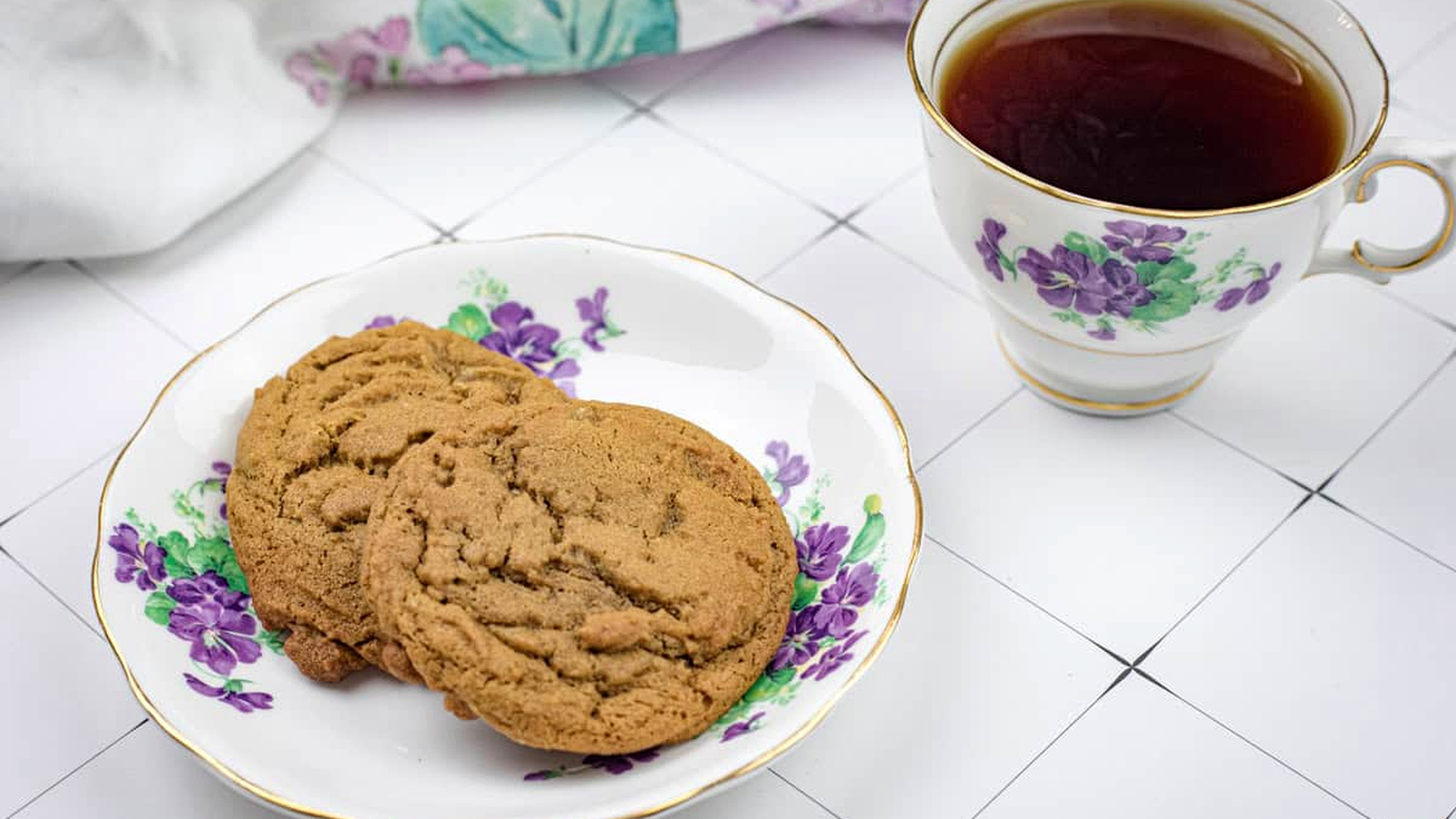 A plate of Spiced Ginger Cookies and a cup of tea.