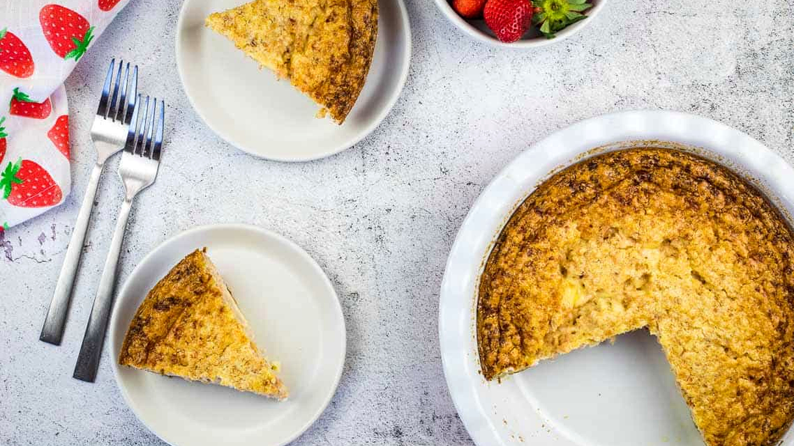 Slices of Ham & Cheese Impossible Quiche next to a whole pie.