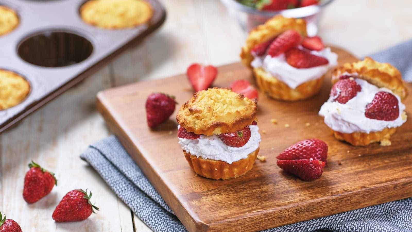 A strawberry shortcake dessert with sliced strawberries and whipped cream.