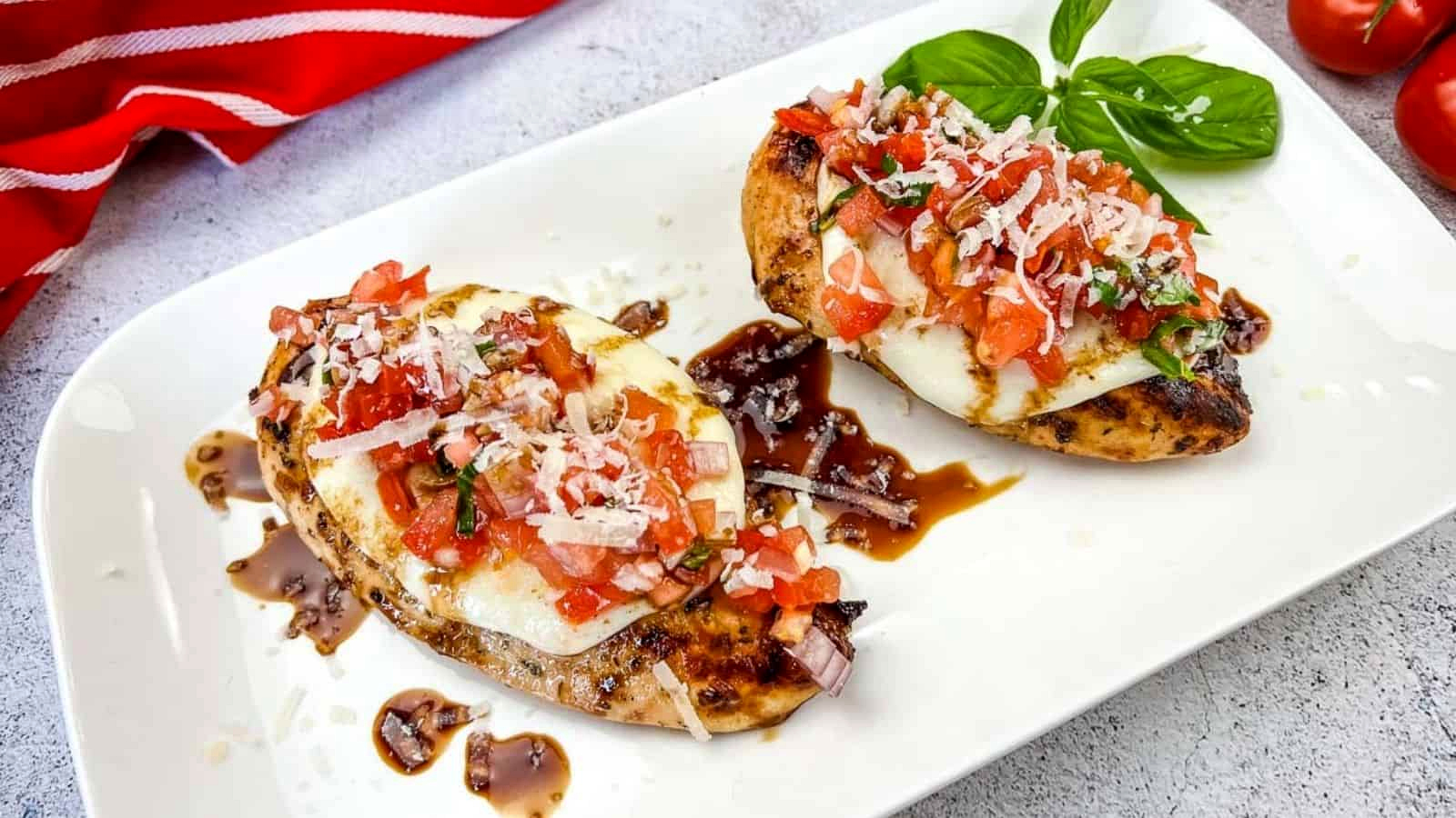 Grilled Bruschetta Chicken on a white plate.