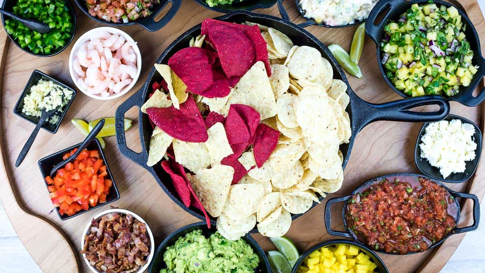 A top-down shot of a guacamole snack board.