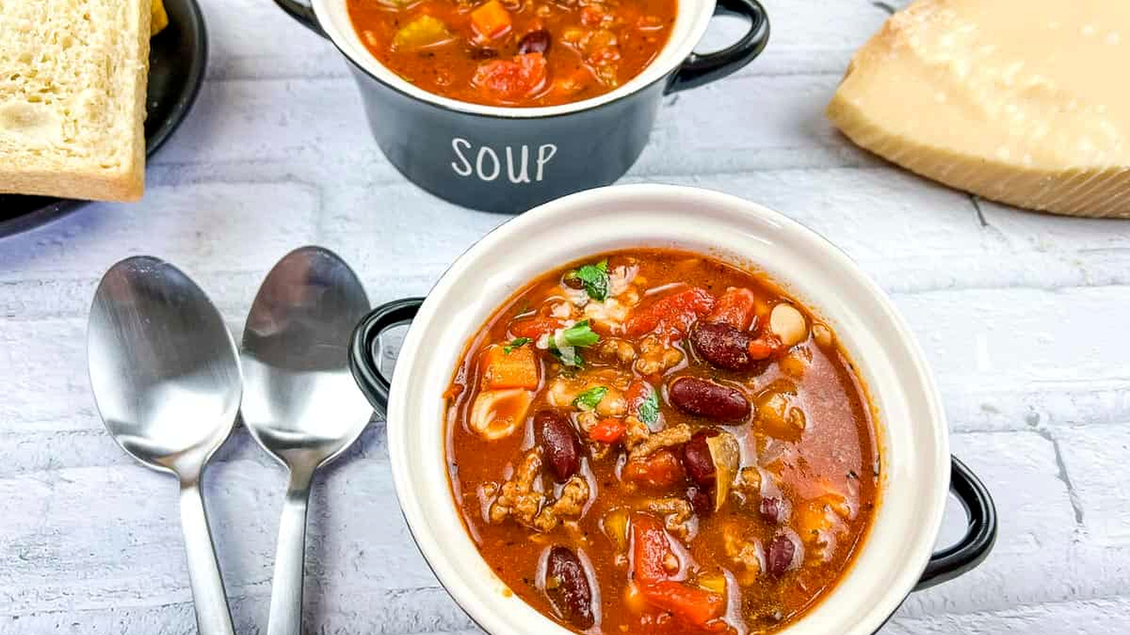 Pasta e Fagioli Soup in 2 bowls with spoons.