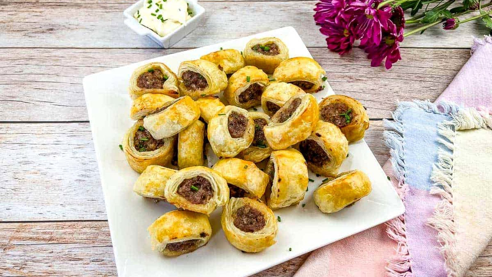 Sausage Rolls on a white plate.