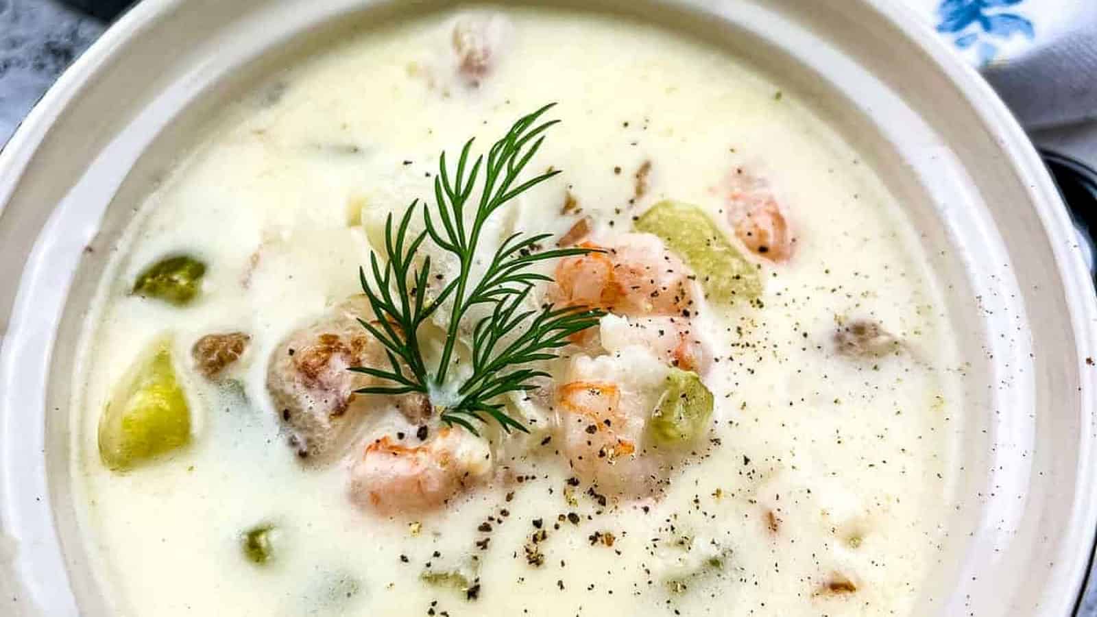 Seafood chowder with a sprig of dill, a delicious stew recipe.