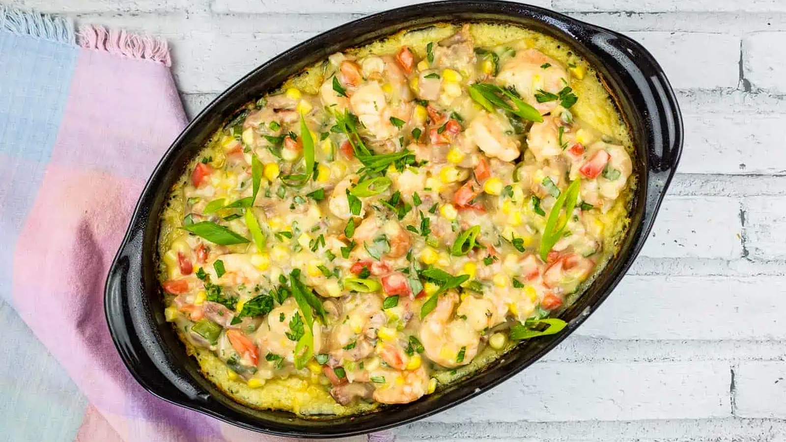 Shrimp and Grits Casserole in a black dish.
