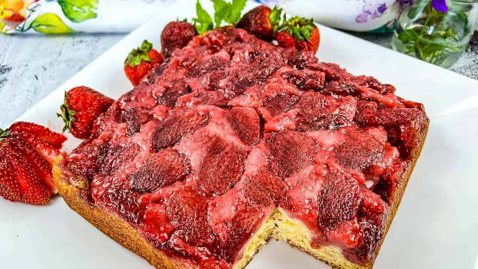 Strawberry Upside Down Cake with a slice missing.