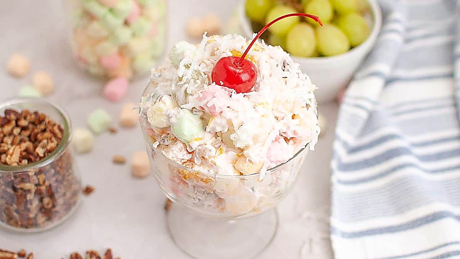 A colorful Ambrosia Salad beautifully arranged in a serving bowl.