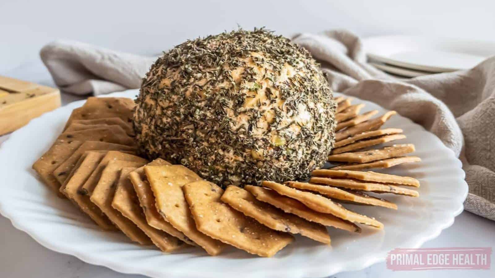 Nut-free cheese ball and crackers on a plate.