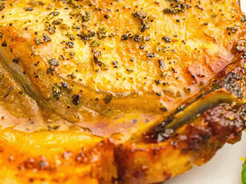 Golden brown air fryer pork chop dinner.