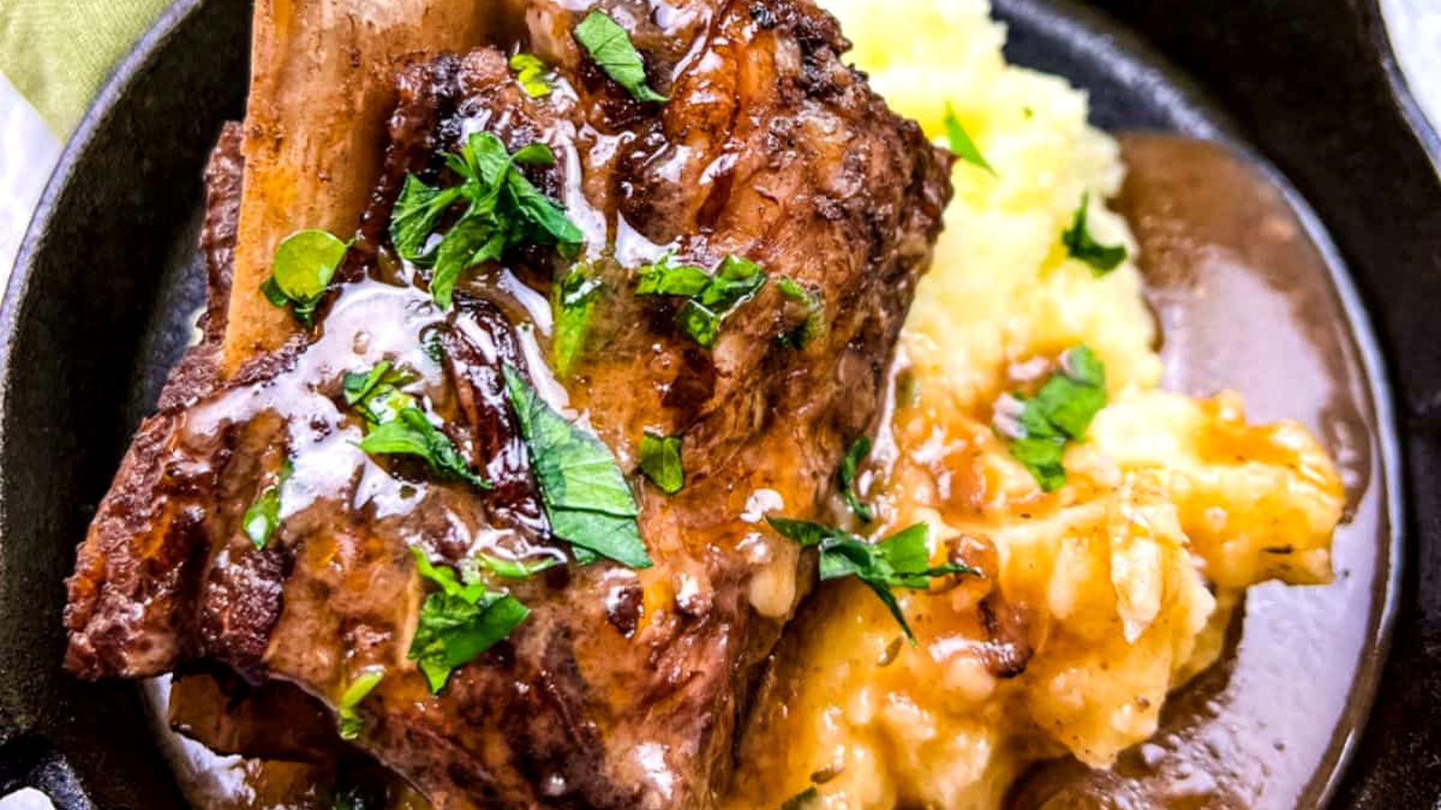 Braised Beef Short Ribs with gravy and mashed potatoes.