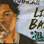A snack bag features an illustrated man holding a finger to his lips, with text reading “Lil Baby ‘All In’ Flavor,” proudly representing one of the standout black-owned food brands.