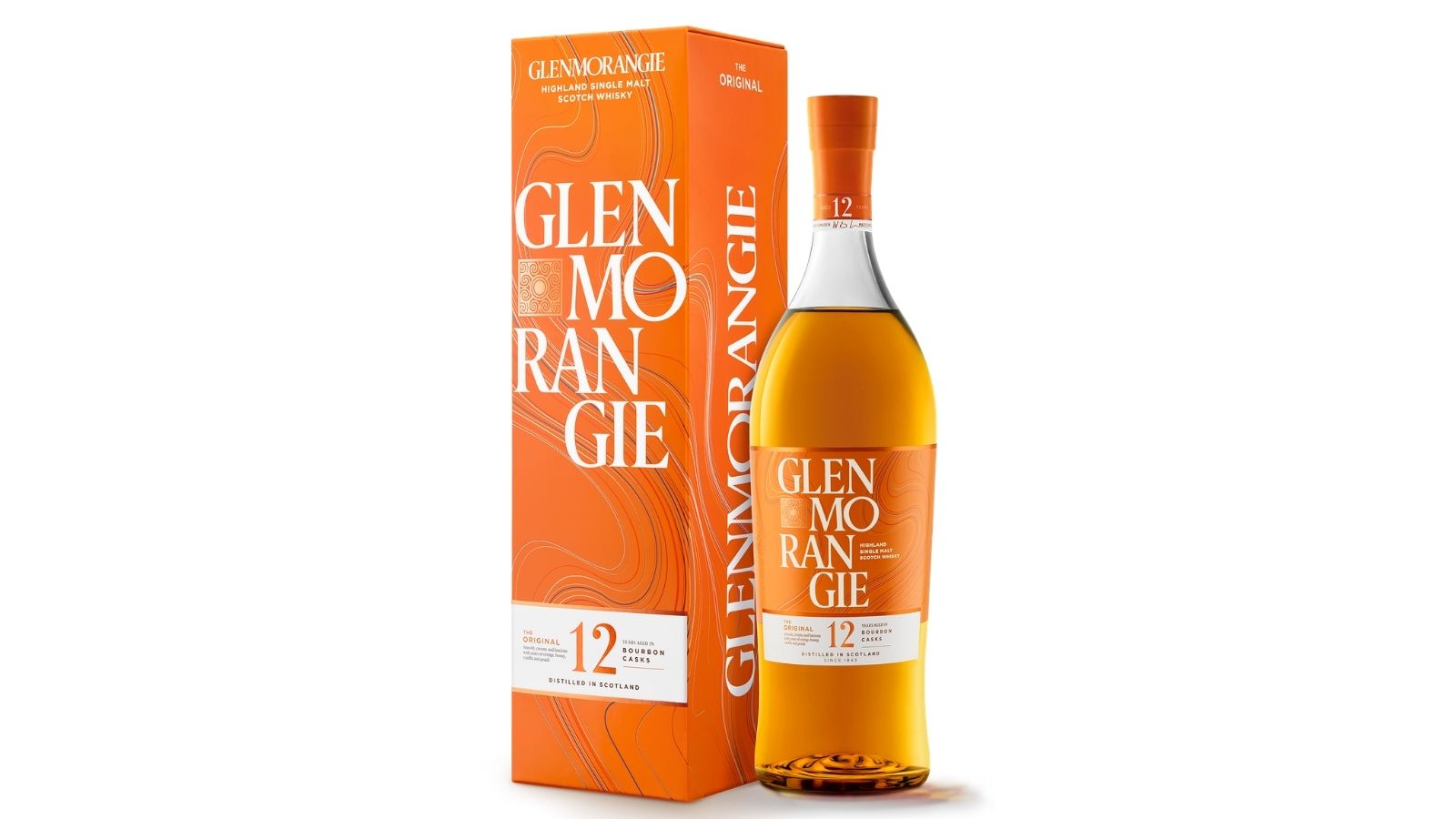 A bottle of Glenmorangie 12-year-old single malt Scotch whisky stands next to its matching orange box, both featuring white and gold text and decorative patterns—a fine example from one of Scotland's most iconic scotch distilleries.