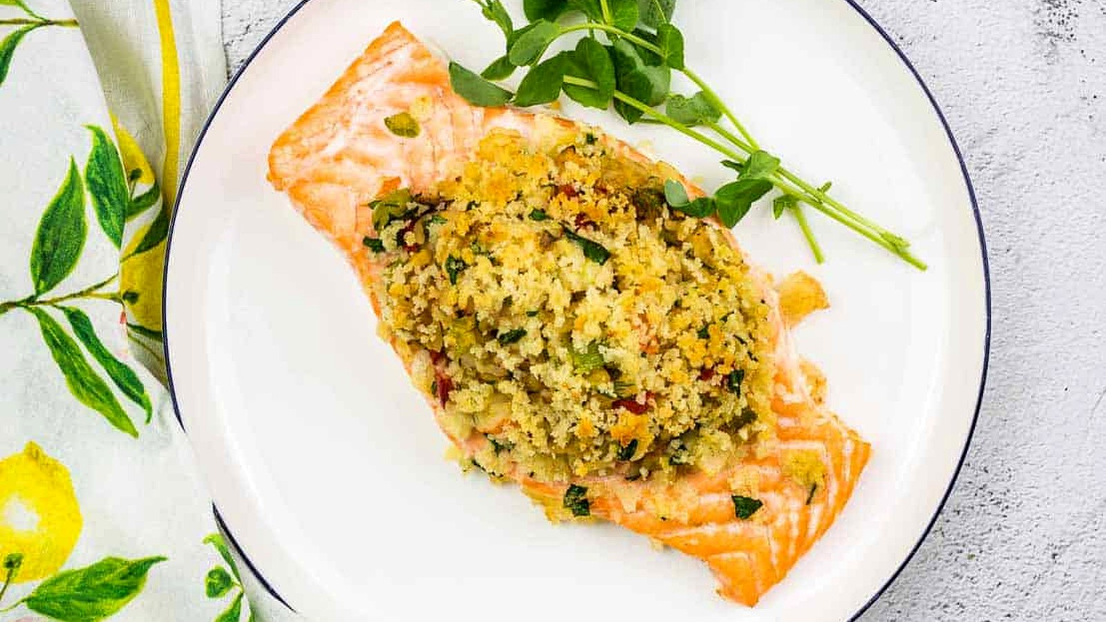 Seafood Stuffed Salmon on a circular white plate.