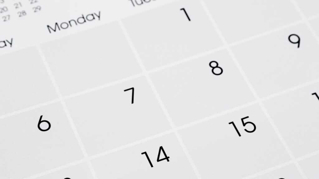 Close-up of a calendar page showing dates 1 to 15, with days of the week labeled at the top, starting with Monday. The layout suggests an early month view, possibly before a late Labor Day, with no specific month or year visible.