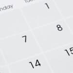 Close-up of a calendar page showing dates 1 to 15, with days of the week labeled at the top, starting with Monday. The layout suggests an early month view, possibly before a late Labor Day, with no specific month or year visible.
