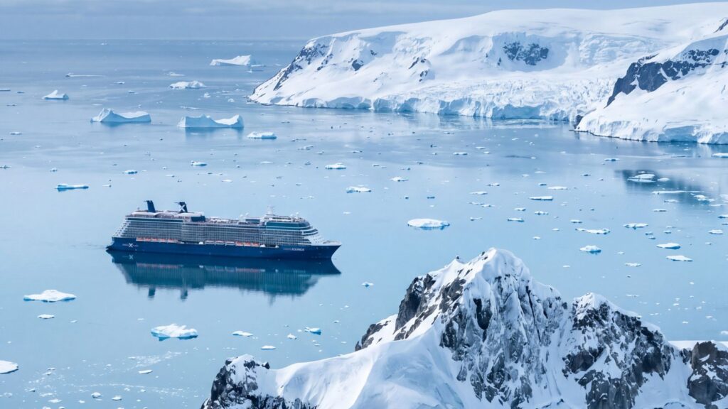 A large Celebrity Cruises ship sails through icy waters surrounded by floating icebergs and snow-covered mountains in a polar region, offering unforgettable voyages for 2028 and 2029.