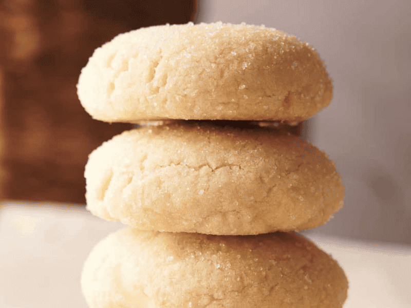 Three sugar cookies stacked on top of each other.