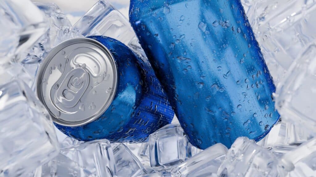 Two blue aluminum cans with condensation&mdash;reminiscent of sodas that had their moment&mdash;are surrounded by clear ice cubes.